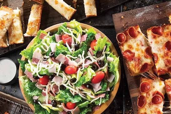 Jet's Pizza salad and pizza spread